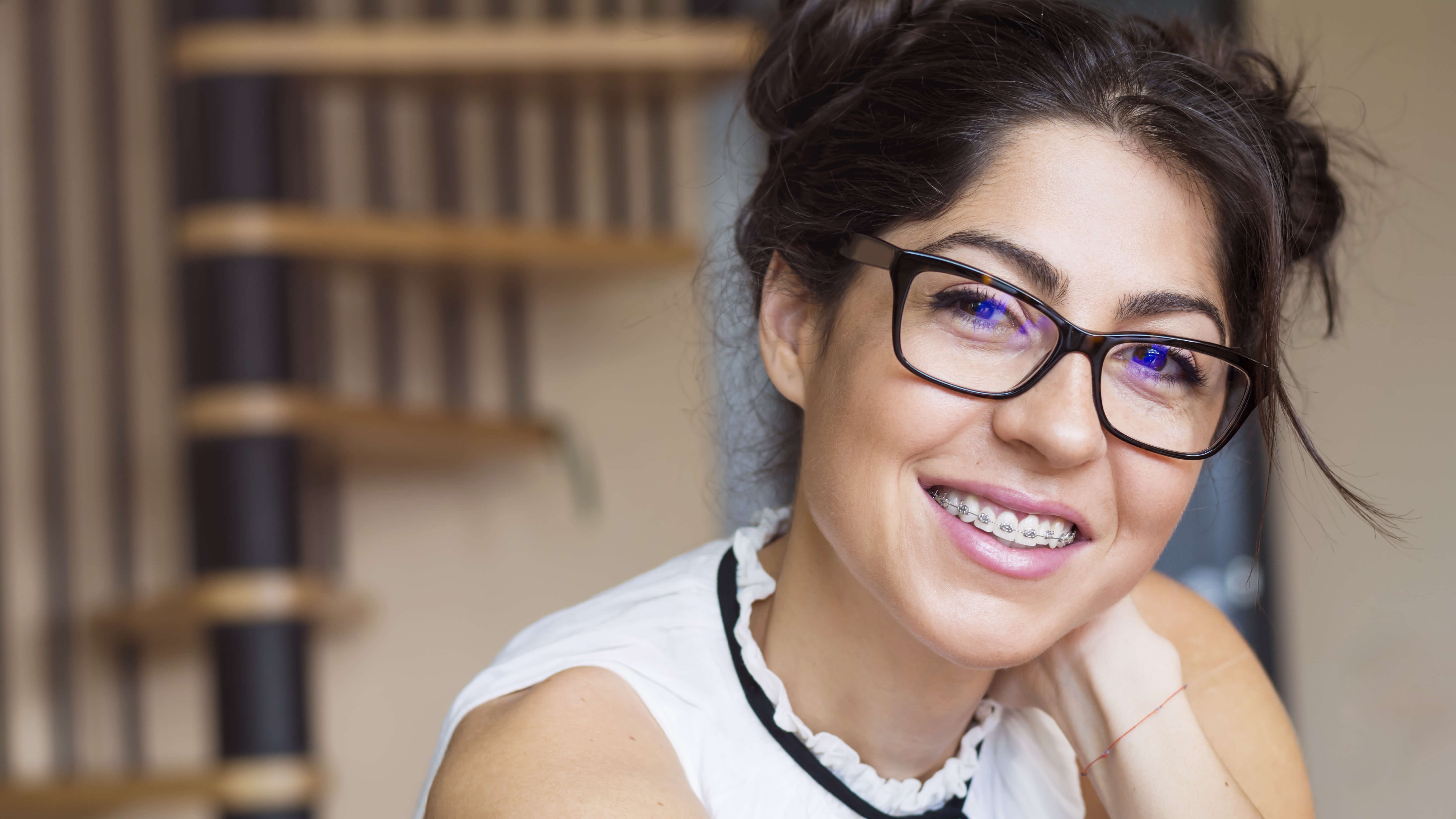 girl with glasses smiling